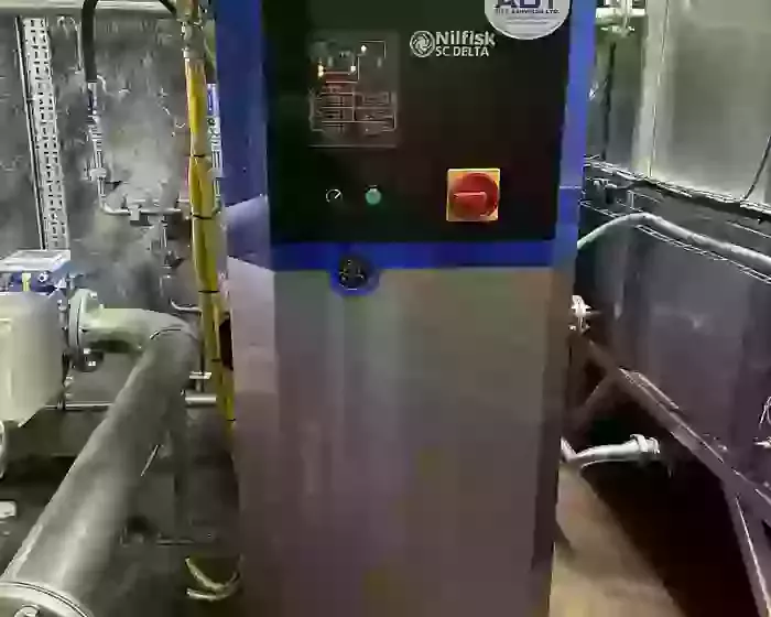 Delta booster pressure washer unit installed to supply multiple high- and low-pressure wash points at an industrial site in Burton.